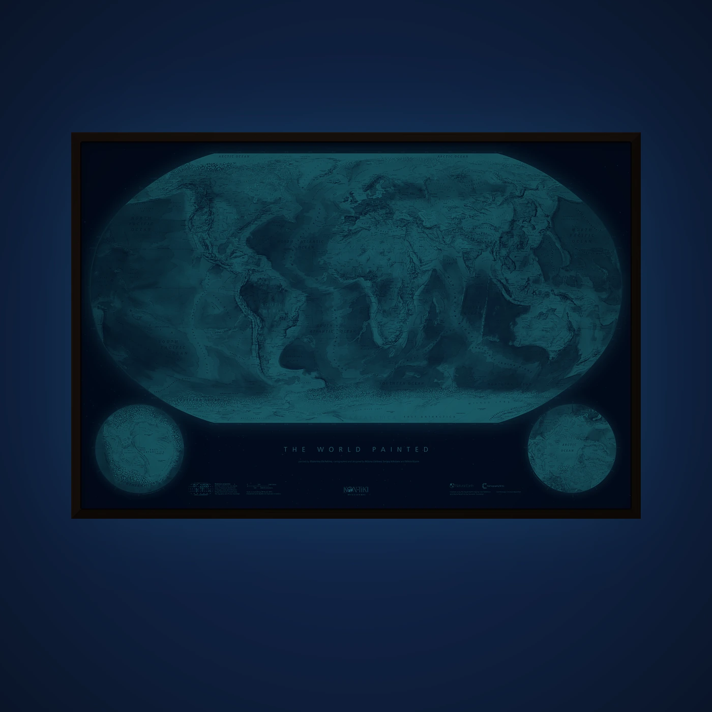 The World Painted glow-in-the-dark print framed on a wall at night